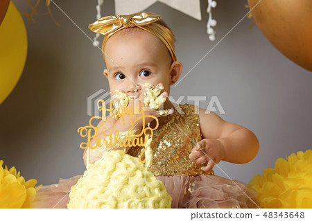 Cute little girl eating cake 48343648