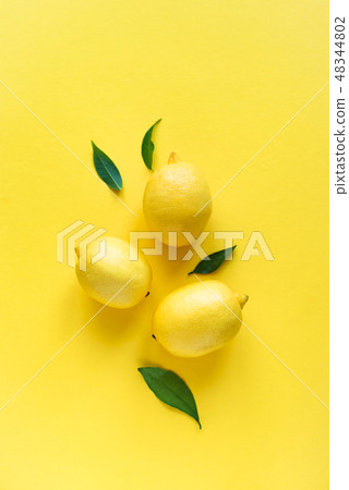 Lemons on yellow 48344802