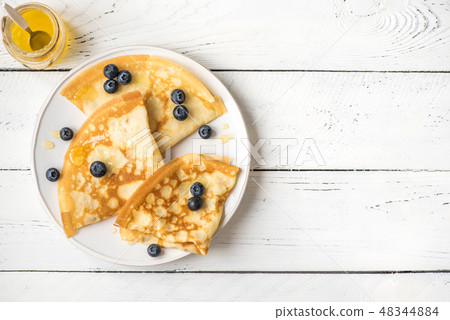 Crepes with blueberries and honey 48344884