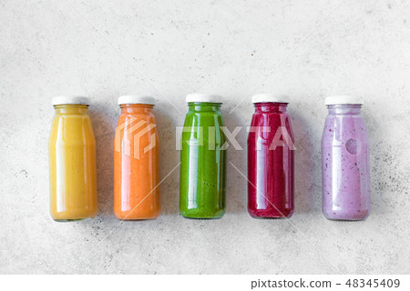 Colorful smoothies bottles 48345409