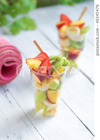 Pink yoga mat and Fruit Salad 48345478