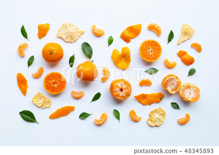 Orange fruits and green leaves on a white Orange fruits and green leaves on a white 48345893