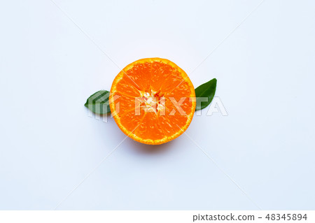 Orange fruit and green leaves on a white 48345894