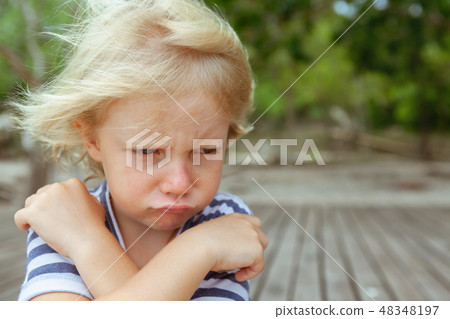 Face portrait of annoyed, unhappy caucasian kid Face portrait of annoyed, unhappy caucasian kid 48348197