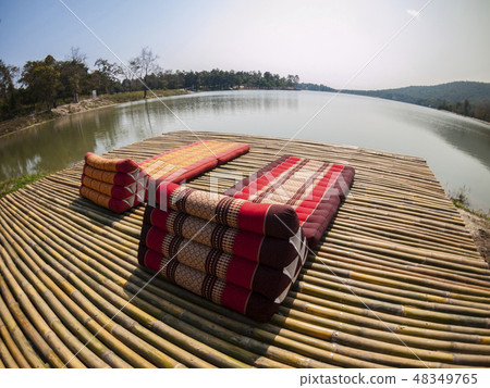 Bed rest is made of bamboo beside the Lake  48349765