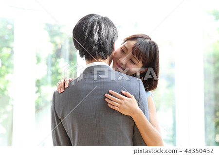 Dressed up men and women 48350432