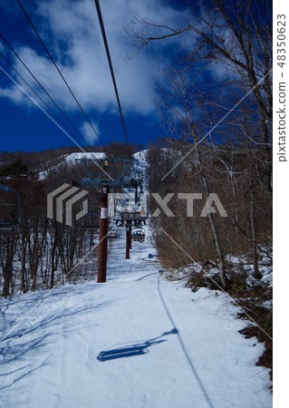 Ski slope climbing a slope lift 48350623