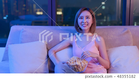 woman watch comedy with popcorn woman watch comedy with popcorn 48355182
