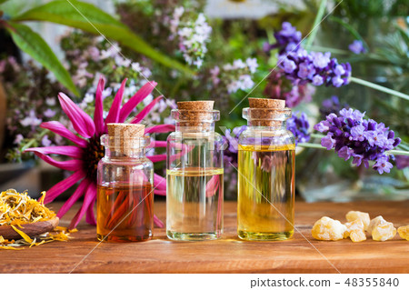 Bottles of essential oil with herbs, frankincense 48355840