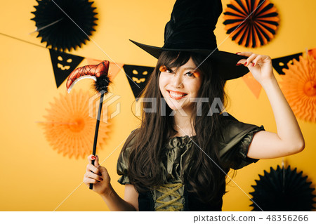 A young girl who makes a witch's cosplay in Halloween Japanese women A young girl who makes a witch's cosplay in Halloween Japanese women 48356266