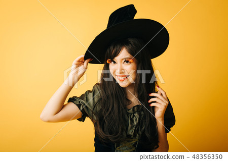 A young girl who makes a witch's cosplay in Halloween Japanese women A young girl who makes a witch's cosplay in Halloween Japanese women 48356350