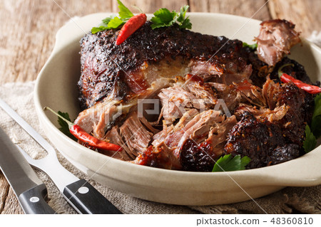 Puerto Rican Pernil asado shredded pork close-up Puerto Rican Pernil asado shredded pork close-up 48360810