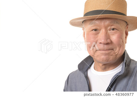 Smiling senior and straw hat Smiling senior and straw hat 48360977