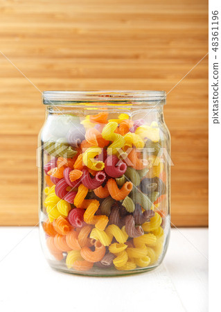 Multicolored Italian pasta in a jar 48361196