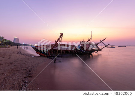Fishing boat wrecks on the beach Sunset 48362060