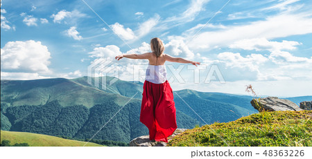 Young woman on the top of mountain Young woman on the top of mountain 48363226