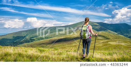 Young woman hiking in the mountains 48363244