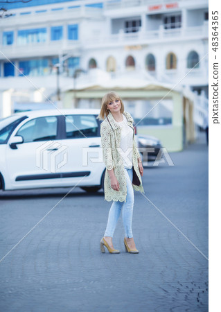 Fashion portrait of pretty hipster blonde girl outdoors in sunny day Fashion portrait of pretty hipster blonde girl outdoors in sunny day 48364365