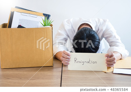 Businessmen are holding resignation document and packing persona 48365584
