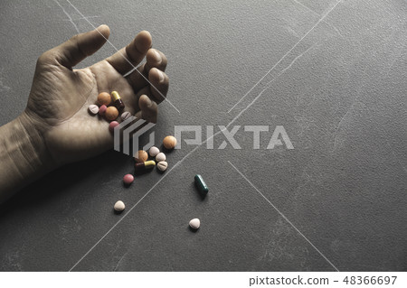 The man committing suicide by overdosing The man committing suicide by overdosing 48366697