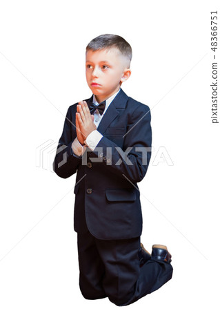 A little boy in a suit praying, isolated A little boy in a suit praying, isolated 48366751