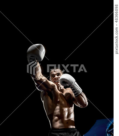 punching boxer on boxing ring 48366898