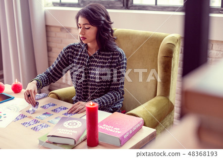 Nice brunette woman sitting at the table 48368193