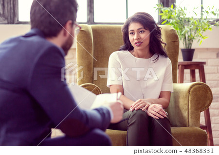 Nice pleasant woman smiling to her doctor 48368331