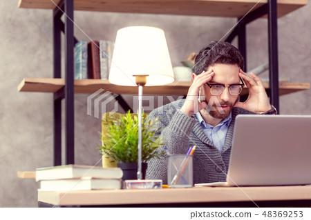 Pleasant nice man working in the office 48369253