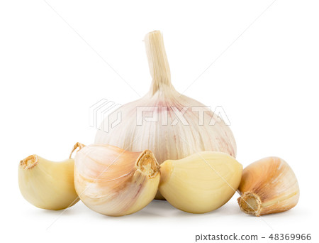 Garlic and pieces closeup on a white. Isolated. Garlic and pieces closeup on a white. Isolated. 48369966