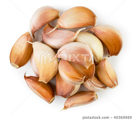 Heap of garlic slices on a white. The form of the Heap of garlic slices on a white. The form of the 48369989