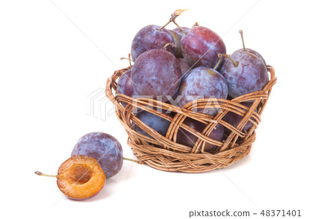 plum in a wicker basket isolated on white background plum in a wicker basket isolated on white background 48371401