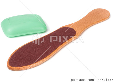 wooden double-sided grater for feet with soap isolated on white background 48371537
