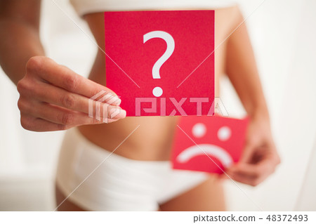 Health. Woman Body In Underwear With Question Card Near Belly Health. Woman Body In Underwear With Question Card Near Belly 48372493