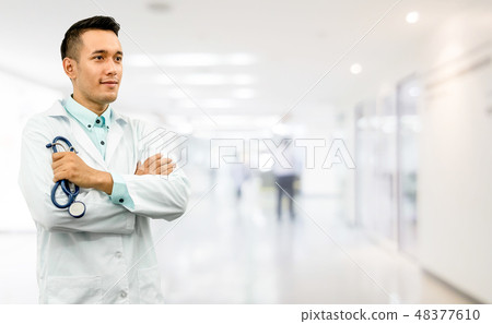 Male doctor standing in the hospital office. Male doctor standing in the hospital office. 48377610
