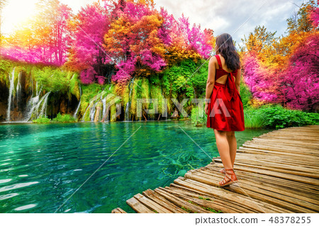 Traveler walk on path in Plitvice Lakes, Croatia. Traveler walk on path in Plitvice Lakes, Croatia. 48378255