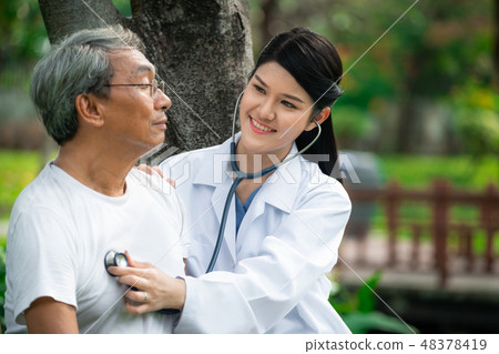 Friendly doctor taking care of senior man. Friendly doctor taking care of senior man. 48378419