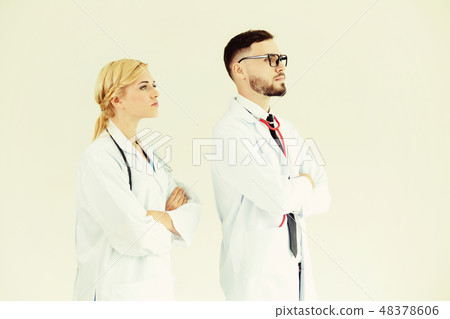 Confident doctors standing with arms crossed. Confident doctors standing with arms crossed. 48378606