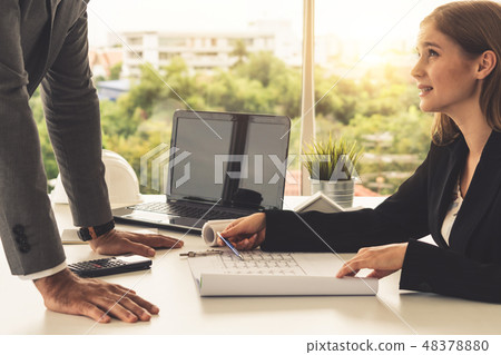 Architect and engineer working with drawing. Architect and engineer working with drawing. 48378880