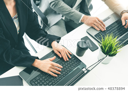 Businessman and businesswoman working in office. Businessman and businesswoman working in office. 48378894