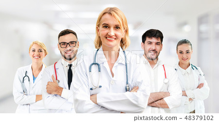 Doctor working in hospital with other doctors. Doctor working in hospital with other doctors. 48379102