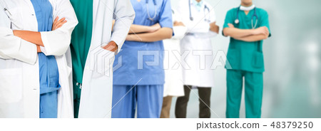 Doctor working in hospital with other doctors. 48379250