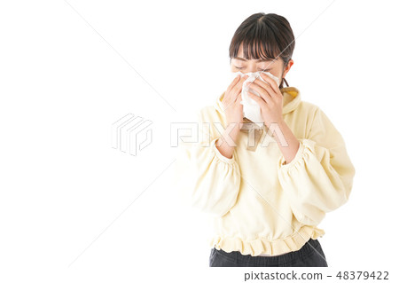 A young woman suffering from hay fever and allergy A young woman suffering from hay fever and allergy 48379422