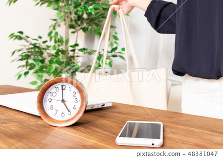 A woman going home on a fixed time A woman going home on a fixed time 48381047