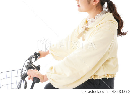 A young woman driving a bicycle 48383850