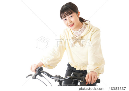 A young woman driving a bicycle 48383887