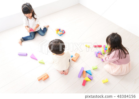 Children playing with blocks 48384156