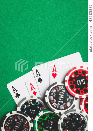 Four aces. Poker cards and chips. 48385882