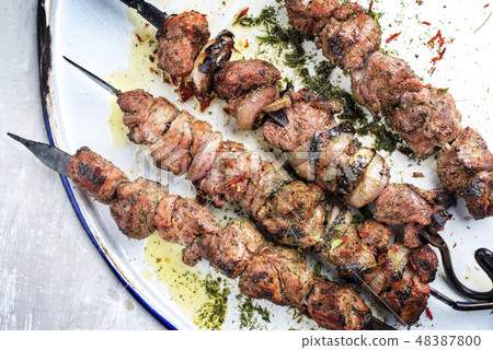 Russian shashlik on a barbecue skewer  48387800