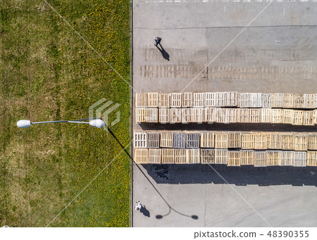 warehouse pallets on the paved area shooting with a drone warehouse pallets on the paved area shooting with a drone 48390355